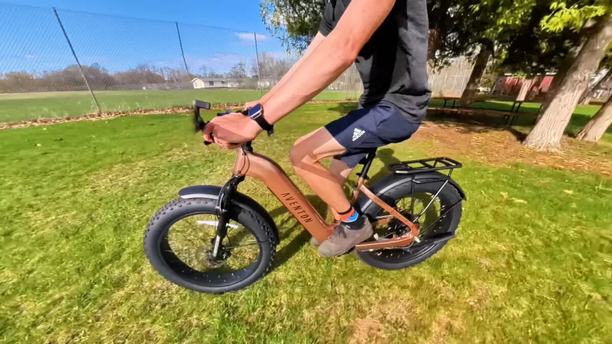 Ryan Riding On Grass On The Aventon Aventure 3