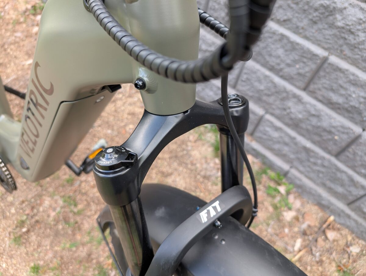 TRAMA front air suspension fork with 100mm of travel on the Velotric Nomad 2X