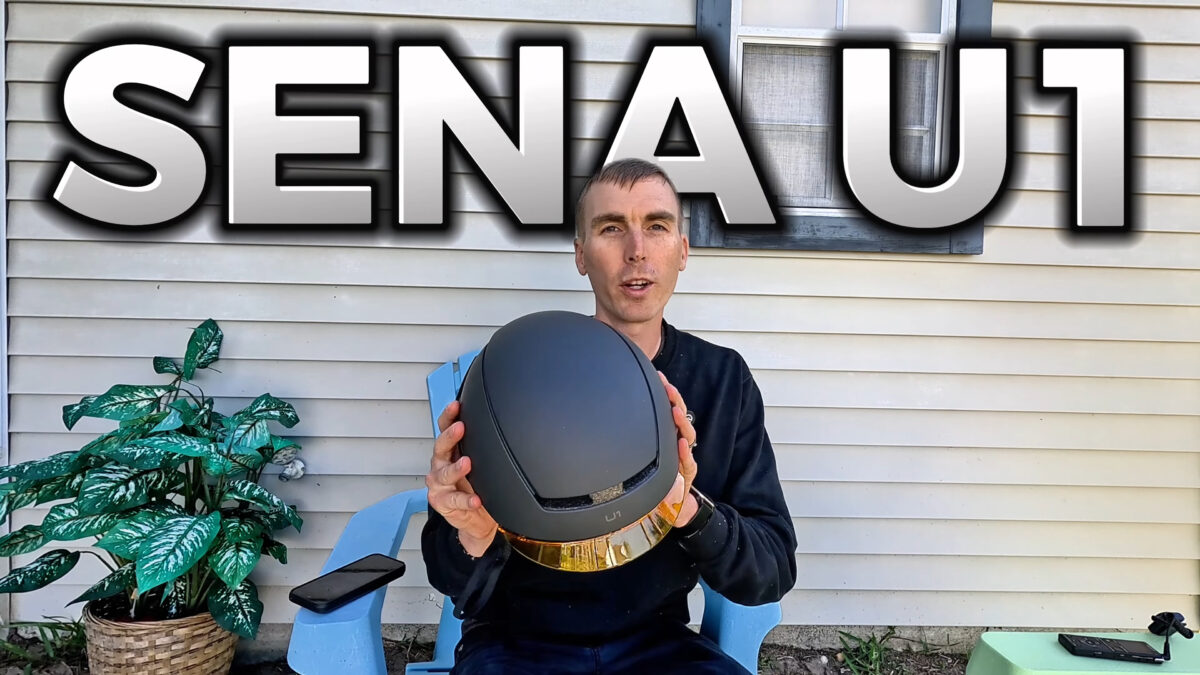 Ryan holding the Sena U1 helmet