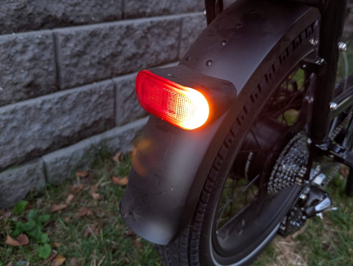 The integrated rear taillight on the RadRunner Max, showing the brake light and turn signal indicators