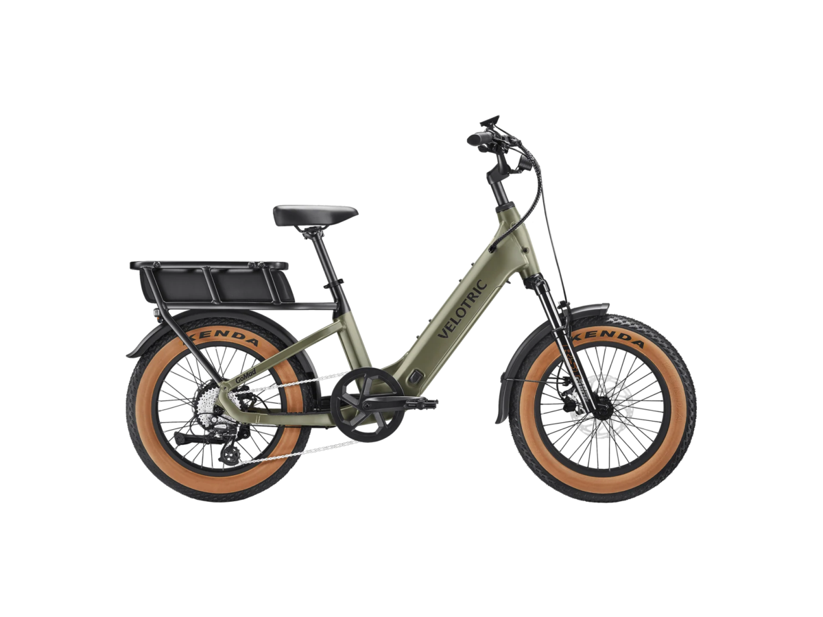 Olive Velotric electric bike shown in profile with a rear cargo rack and tan-wall tires.