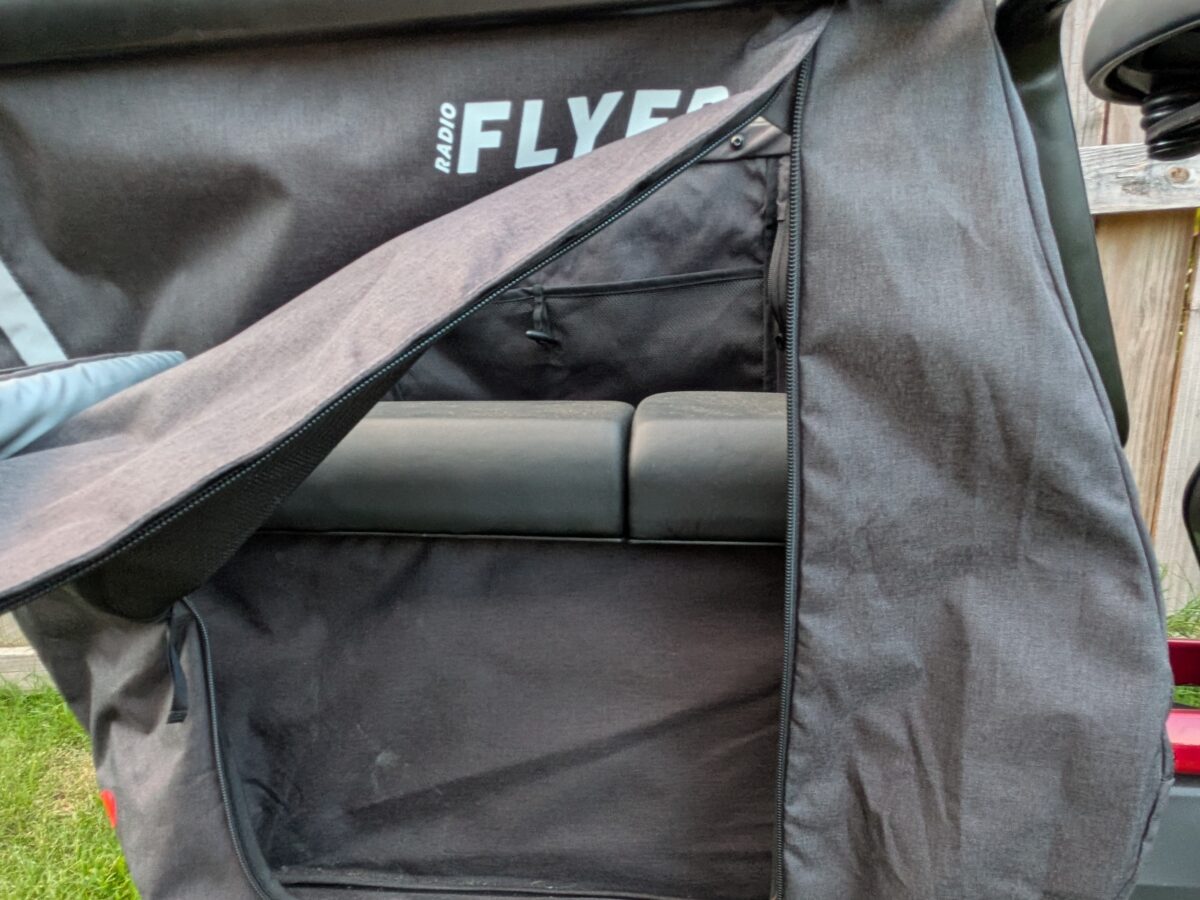 Cubby Kaboodle zippered side access flap with Radio Flyer logo on the Flyer Loop