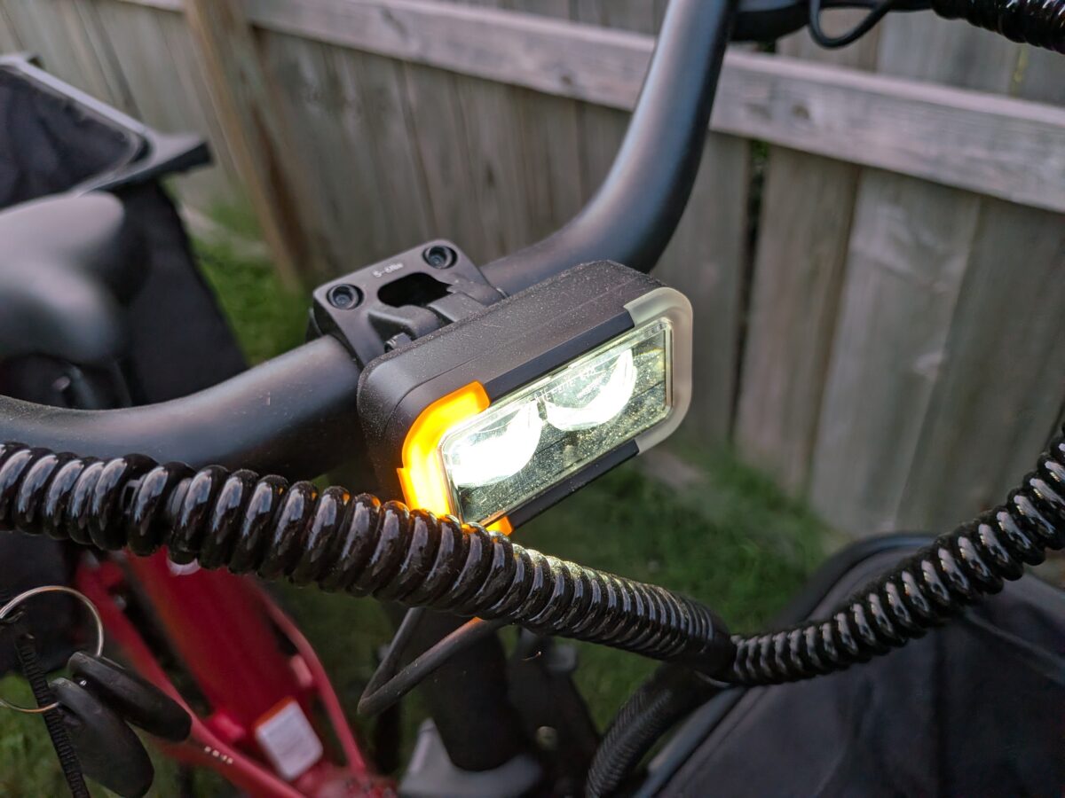 High-mounted LED headlight with amber turn signal lit on the Radio Flyer Flyer Loop