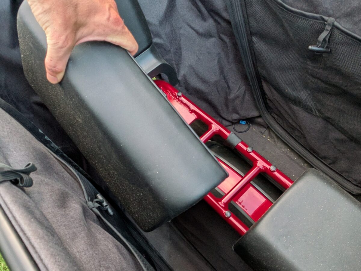 Removable Cubby Kit seat pad lifted from the rear rack of the Radio Flyer Flyer Loop