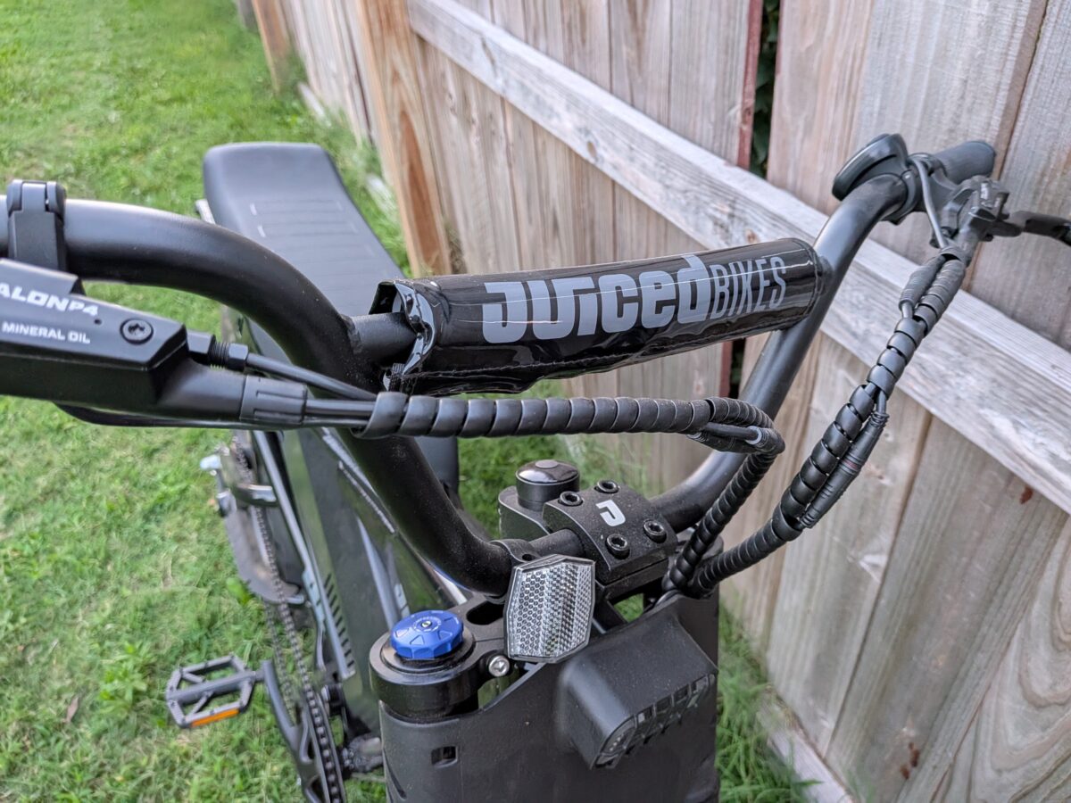 BMX-style handlebars and cockpit on the Juiced Scrambler Full Suspension