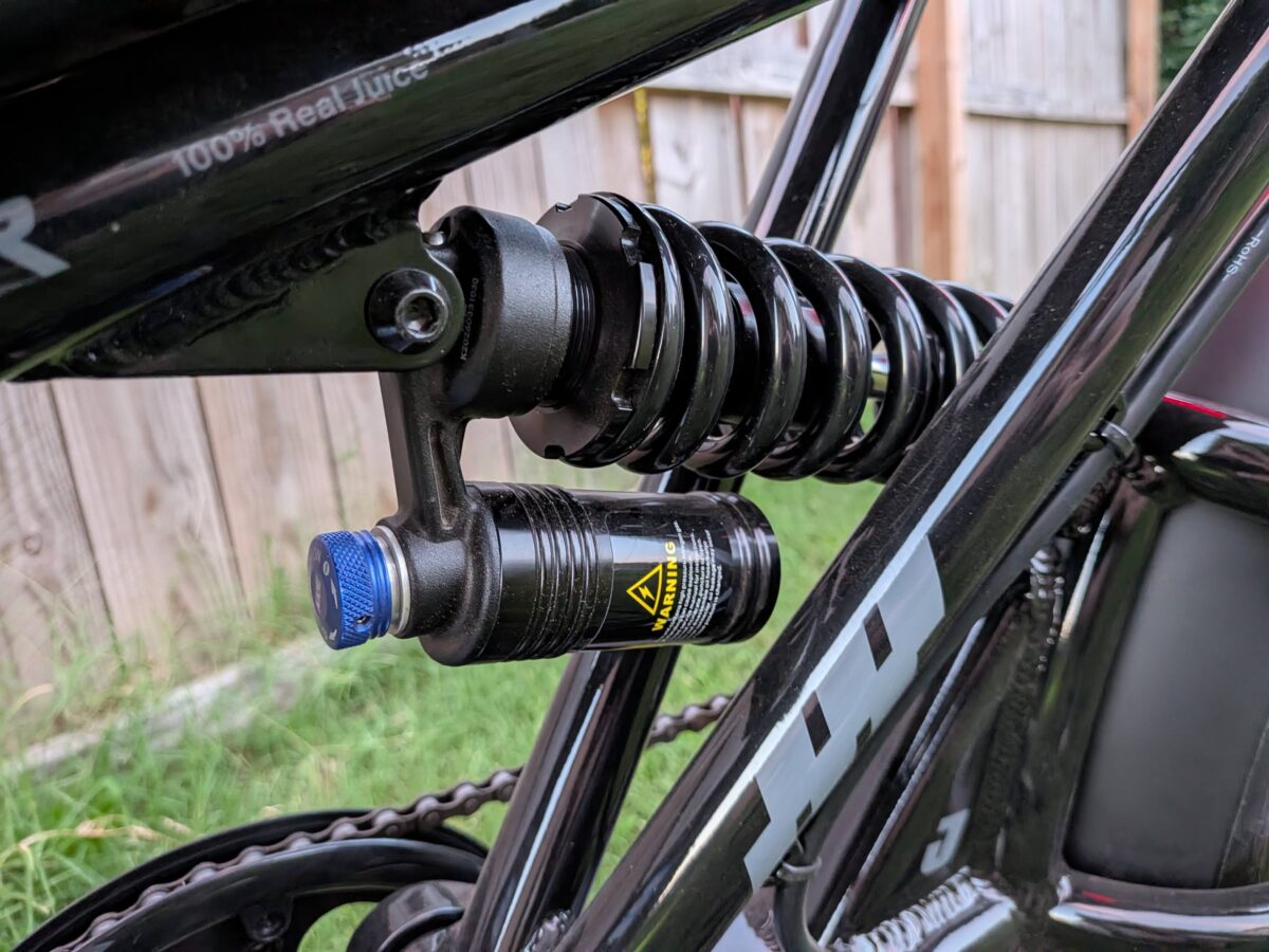 Rear coil shock compression adjuster on the Juiced Scrambler Full Suspension