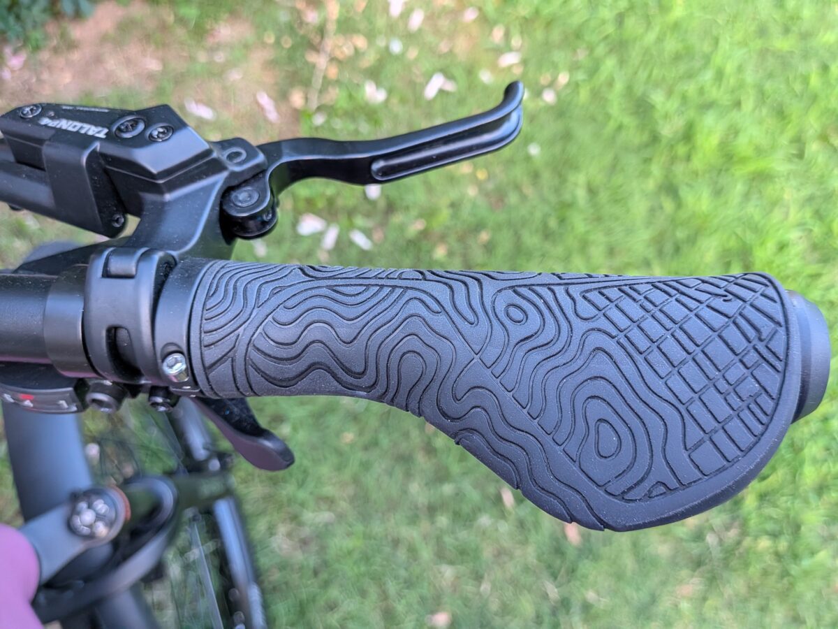 Lock-on ergonomic grips with a topographic pattern on the Monarc Tracer