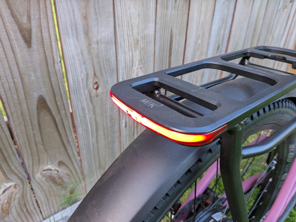 Rack-integrated taillight on the Monarc Tracer with the brake light illuminated