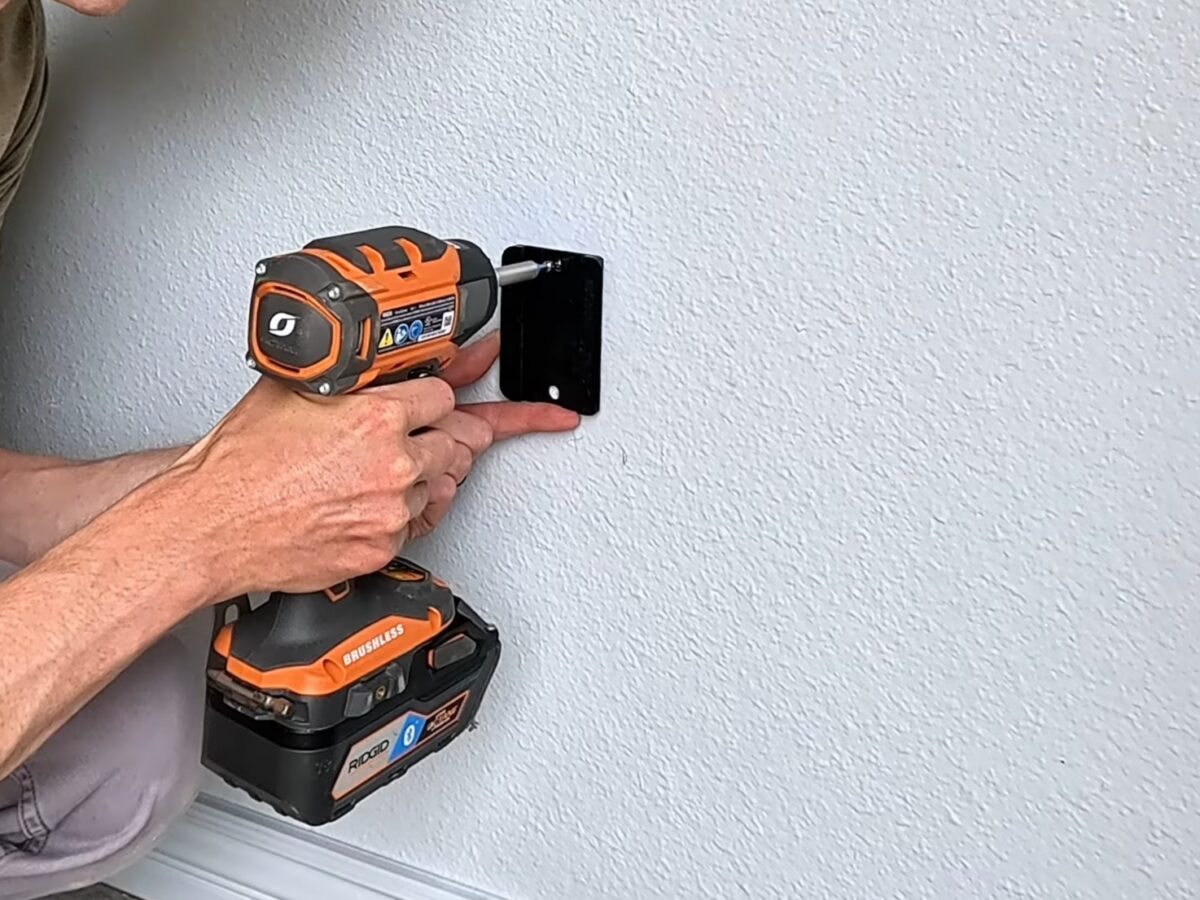Installing the rear tire wall protector plate below a Steadyrack ProFlex