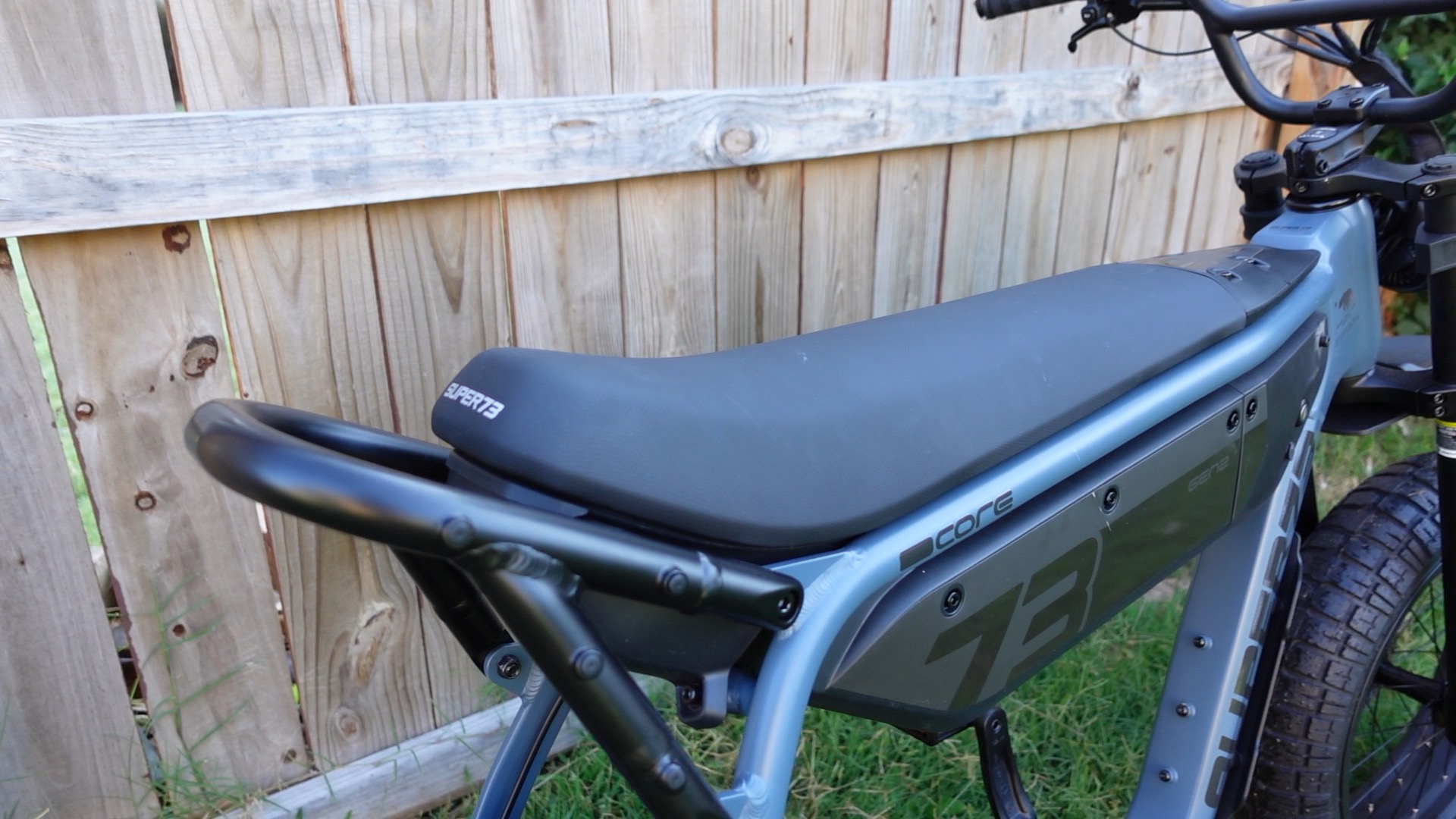 Flip-up seat revealing the removable battery on the SUPER73-B1G