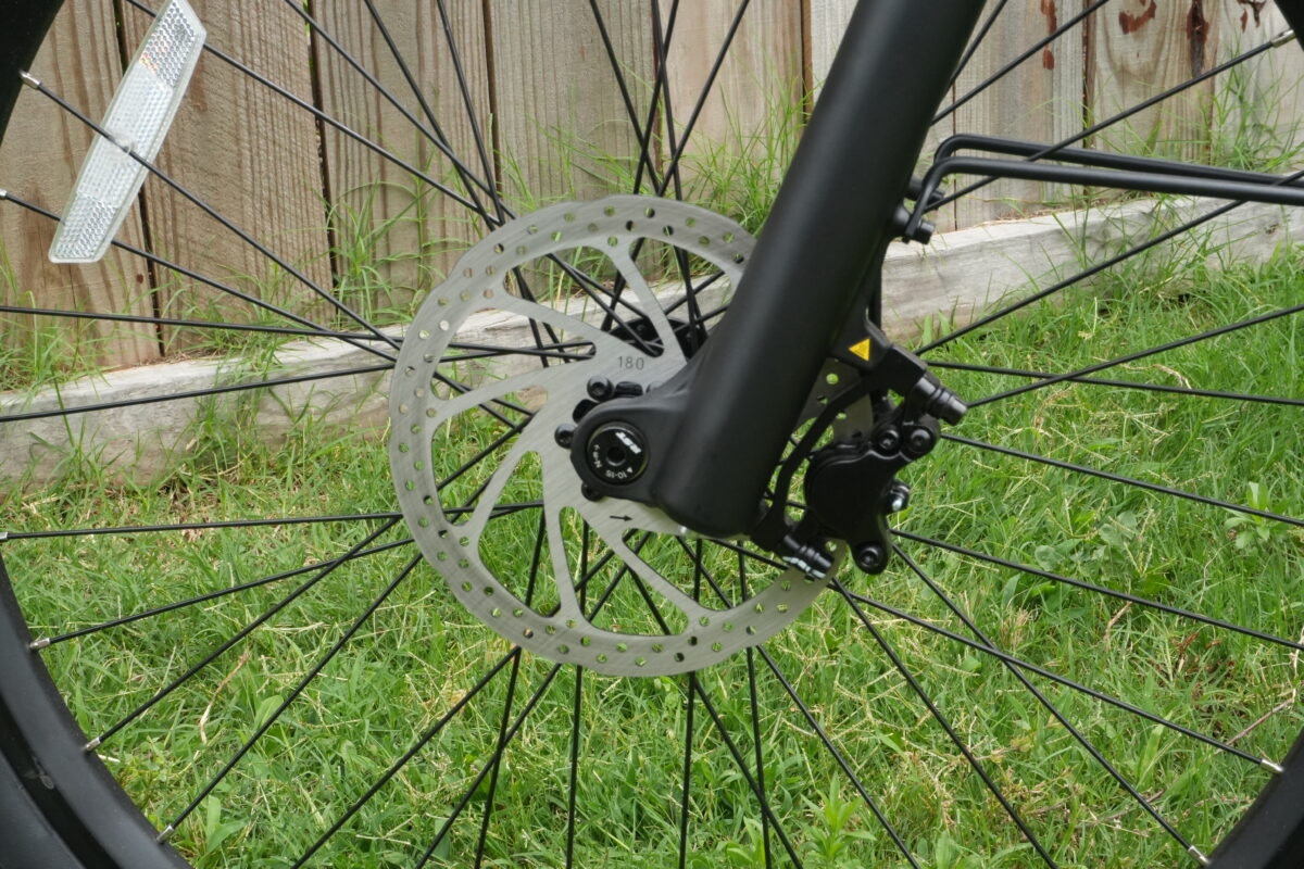 Front two-piston hydraulic disc brake with 180mm rotor on the Segway Myon.