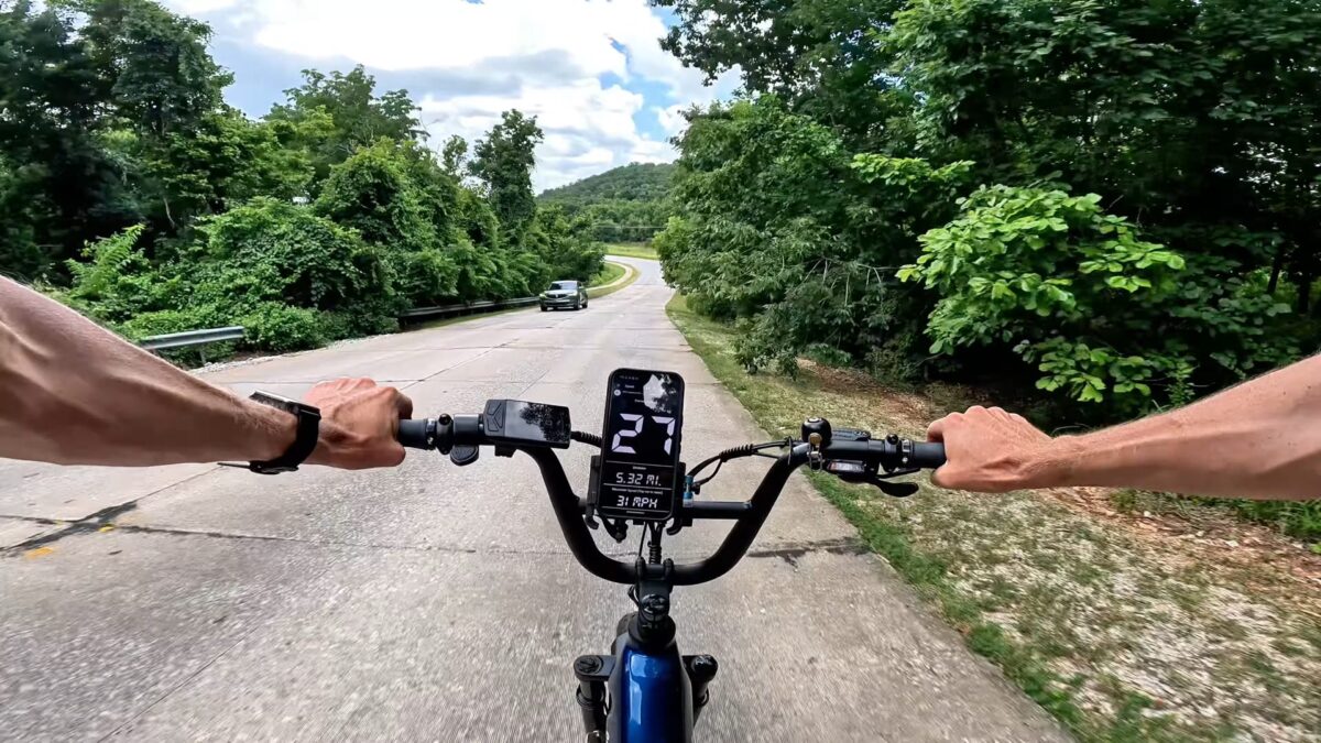 GPS speedometer app showing 27 mph in large digits on a BiKGrip phone holder mounted to a Euphree Cosmic Jay
