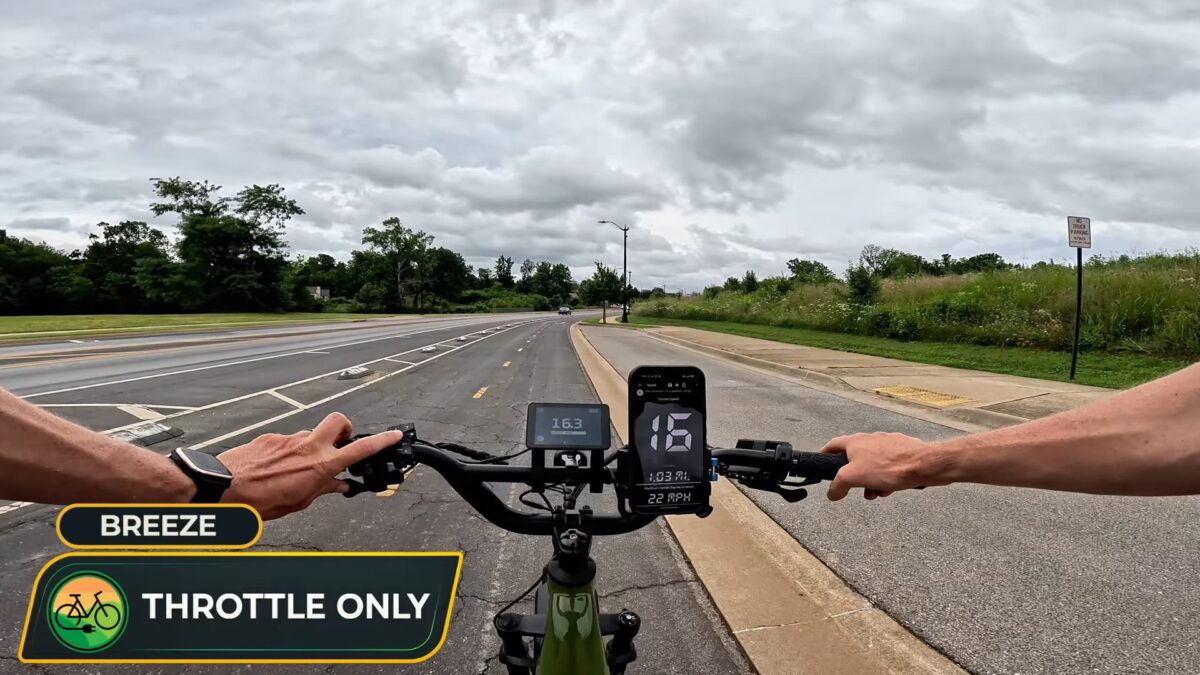 Monarc Marker display reading 16.3 mph next to a GPS speedometer app showing 16 mph on a BiKGrip phone holder