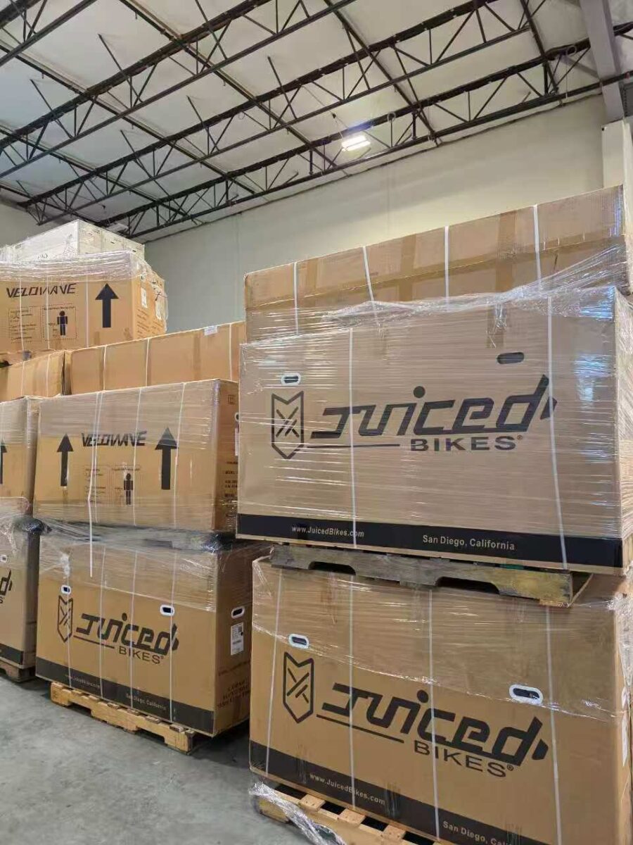 Stacked Juiced Bikes shipping boxes at Napune’s US warehouse